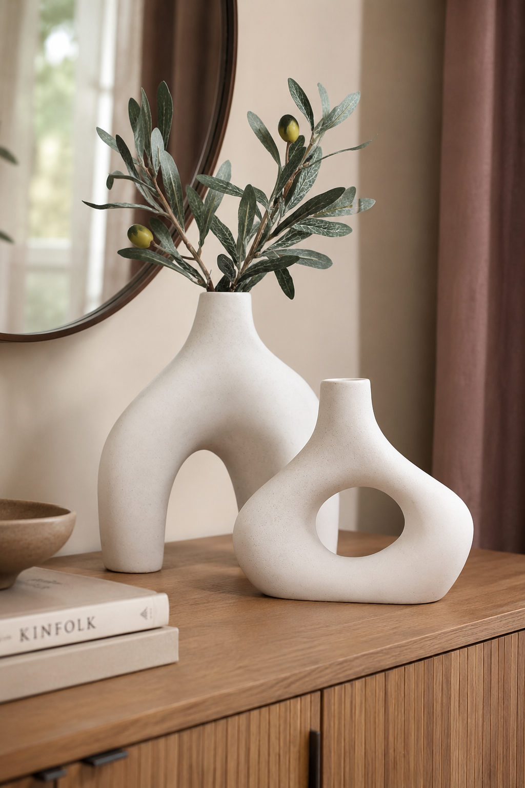 Carrot's Den ceramic vase set with olive branches styled on a warm wood console.