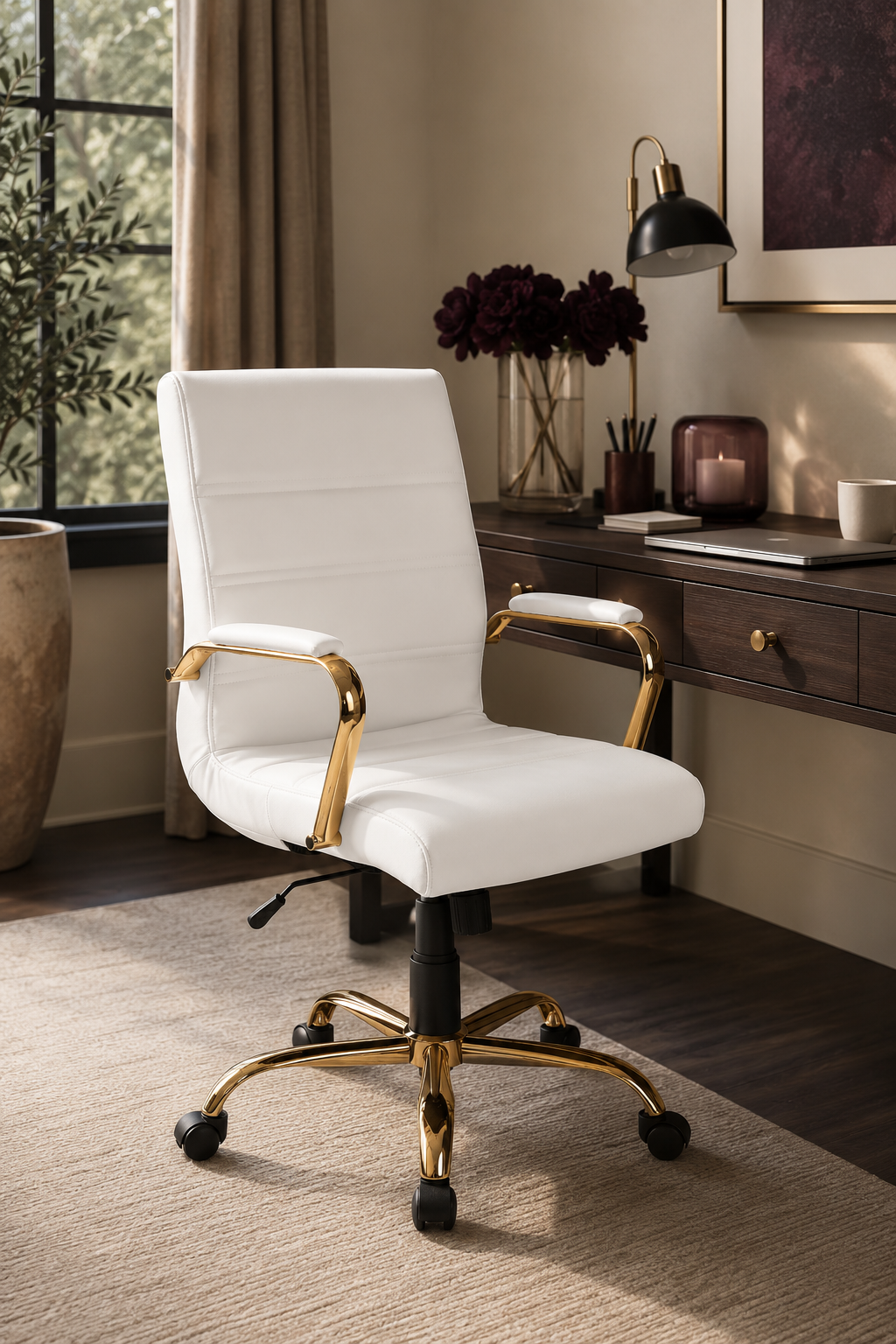 White mid-back swivel desk chair with gold-tone arms and base styled in a polished home office.
